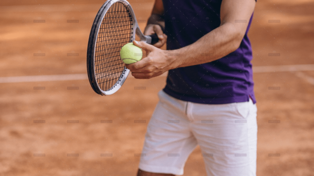 demo-attachment-24-young-man-tennis-player-court-tennis-racket-close-up1